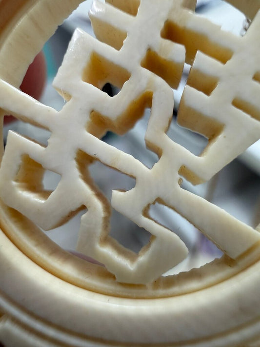 Carved bone Chinese Double Happiness openwork pendant